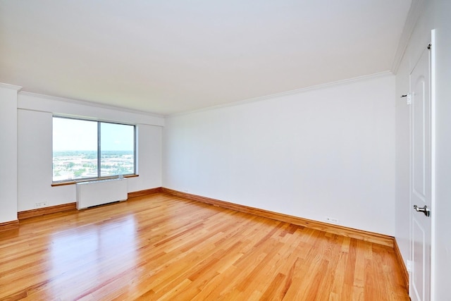 7033 N Kedzie Ave Unit 1706, Chicago, IL 60645 - empty room featuring radiator heating unit, light wood-style flooring, and ornamental molding