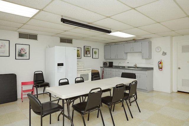 7033 N Kedzie Ave Unit 1706, Chicago, IL 60645 - dining room featuring a paneled ceiling and light flooring
