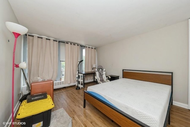 1400 E 55th Pl Unit 304S, Chicago, IL 60637 - bedroom with wood finished floors and radiator heating unit