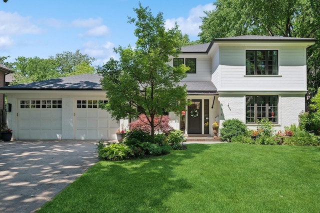 624 Laurel Ave, Wilmette, IL 60091 - view of front of home featuring concrete driveway, a garage, a front lawn, brick siding, and roof with shingles