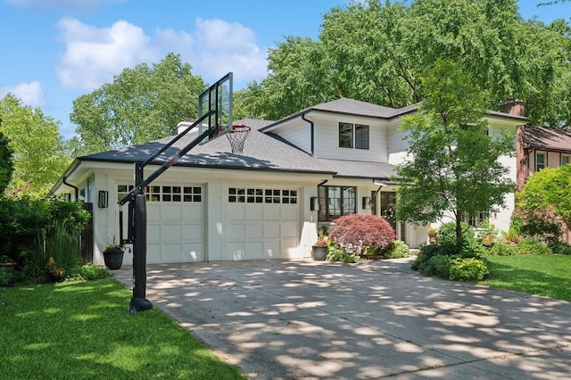 624 Laurel Ave, Wilmette, IL 60091 - view of front of home with an attached garage, driveway, a front yard, and roof with shingles