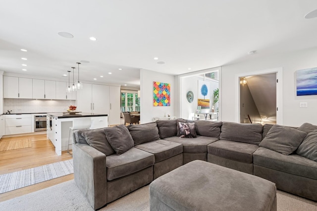 624 Laurel Ave, Wilmette, IL 60091 - living room with recessed lighting and light wood finished floors