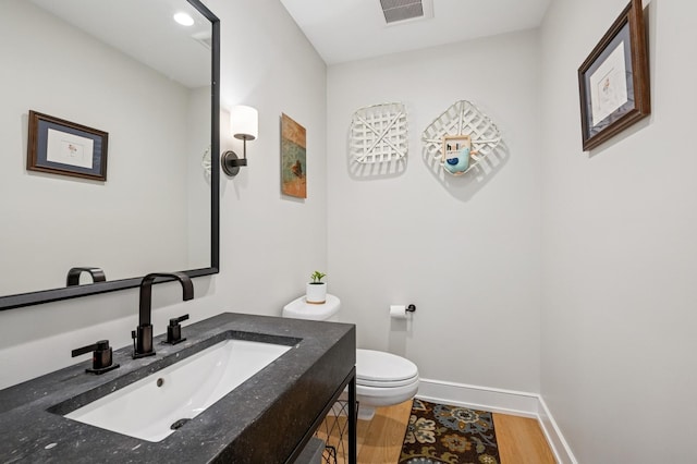 624 Laurel Ave, Wilmette, IL 60091 - half bath with vanity and wood finished floors