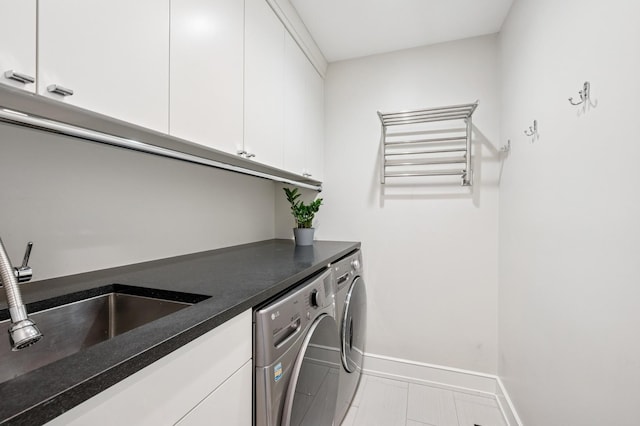 624 Laurel Ave, Wilmette, IL 60091 - laundry room featuring cabinet space, washer and dryer, and light tile patterned flooring