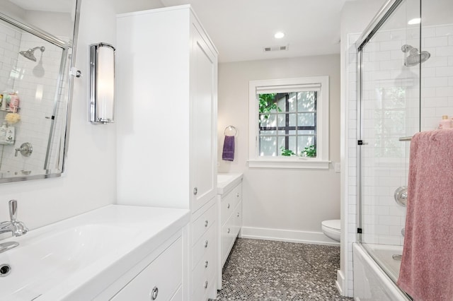 624 Laurel Ave, Wilmette, IL 60091 - bathroom with vanity, recessed lighting, and enclosed tub / shower combo