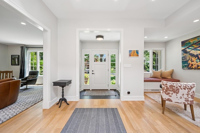 624 Laurel Ave, Wilmette, IL 60091 - entrance foyer with wood finished floors, plenty of natural light, and recessed lighting