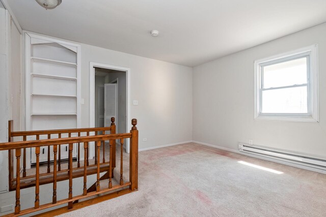 3645 177th Pl, Lansing, IL 60438 - carpeted empty room featuring baseboard heating, built in shelves, and a smoke detector