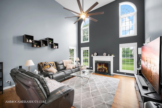 4 Dryden Ct, Algonquin, IL 60102 - living room with a ceiling fan, high vaulted ceiling, wood finished floors, healthy amount of natural light, and a high end fireplace