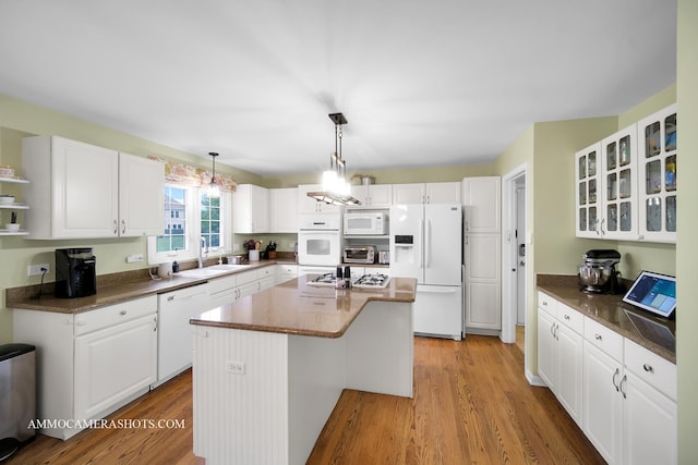 4 Dryden Ct, Algonquin, IL 60102 - kitchen with white appliances, a kitchen island, white cabinets, and light wood-type flooring
