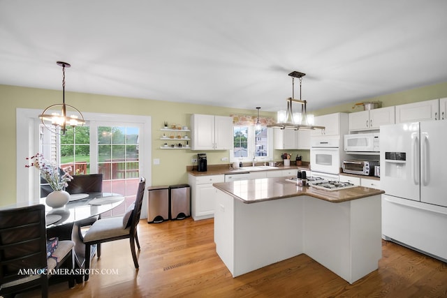 4 Dryden Ct, Algonquin, IL 60102 - kitchen featuring white appliances, a chandelier, white cabinets, and healthy amount of natural light