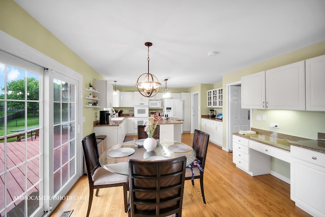 4 Dryden Ct, Algonquin, IL 60102 - dining space with light wood finished floors, a chandelier, and built in desk