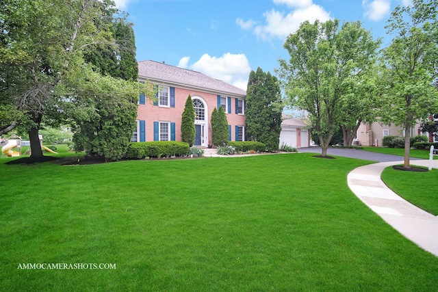4 Dryden Ct, Algonquin, IL 60102 - colonial house featuring a front yard, brick siding, a garage, and driveway