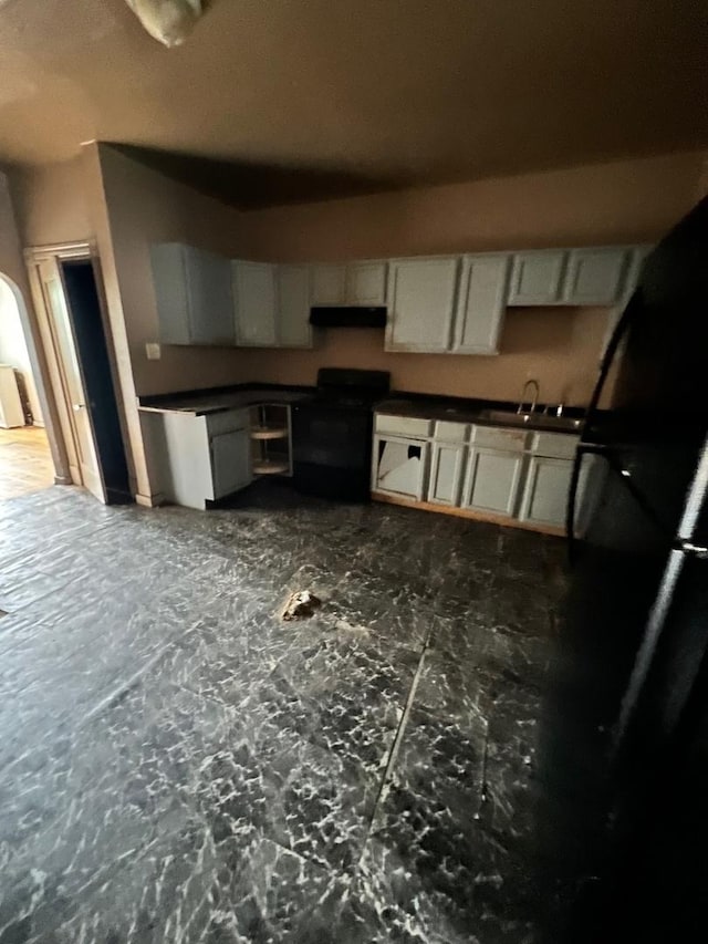 10614 S Langley Ave Unit 10614, Chicago, IL 60628 - kitchen featuring black range, exhaust hood, and dark countertops
