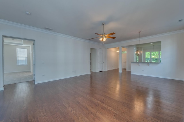 3866 Kingsmill Dr, Elgin, IL 60124 - unfurnished living room with a chandelier, crown molding, ceiling fan, healthy amount of natural light, and dark wood-type flooring