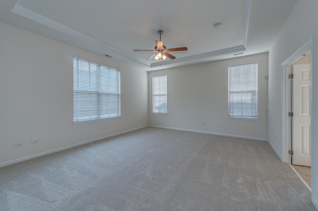 3866 Kingsmill Dr, Elgin, IL 60124 - empty room featuring a tray ceiling, light colored carpet, a ceiling fan, and ornamental molding