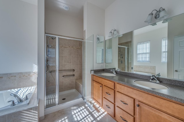 3866 Kingsmill Dr, Elgin, IL 60124 - bathroom featuring double vanity, a garden tub, a shower stall, and tile patterned floors