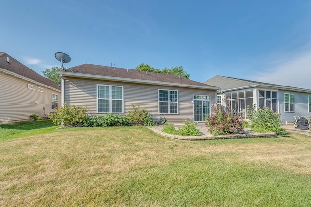3866 Kingsmill Dr, Elgin, IL 60124 - back of house featuring a sunroom, a lawn, and a patio area