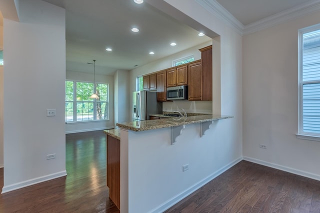 3866 Kingsmill Dr, Elgin, IL 60124 - kitchen with appliances with stainless steel finishes, dark wood-type flooring, recessed lighting, brown cabinets, and light stone counters