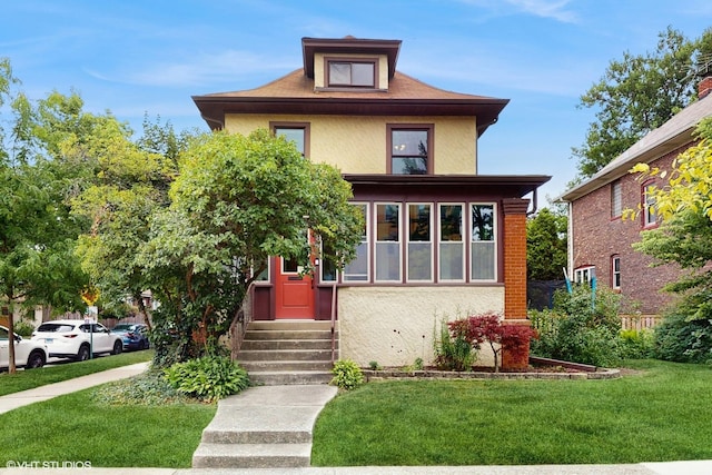 1150 S Oak Park Ave, Oak Park, IL 60304 - traditional style home featuring entry steps, a front lawn, and stucco siding