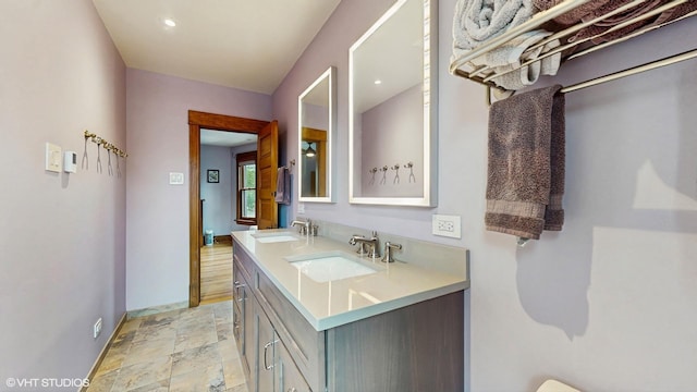 1150 S Oak Park Ave, Oak Park, IL 60304 - bathroom with double vanity and stone finish flooring