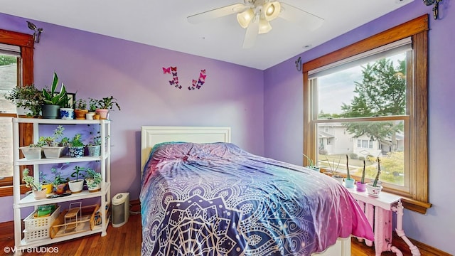 1150 S Oak Park Ave, Oak Park, IL 60304 - bedroom with multiple windows, wood finished floors, and ceiling fan