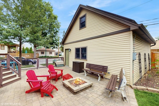 1150 S Oak Park Ave, Oak Park, IL 60304 - fenced backyard with a fire pit and a patio area