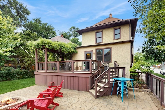 1150 S Oak Park Ave, Oak Park, IL 60304 - back of property featuring a patio, stucco siding, a wooden deck, and stairway