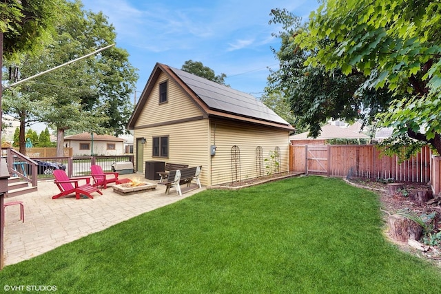 1150 S Oak Park Ave, Oak Park, IL 60304 - rear view of property featuring an outdoor fire pit, a patio area, a fenced backyard, and a gate