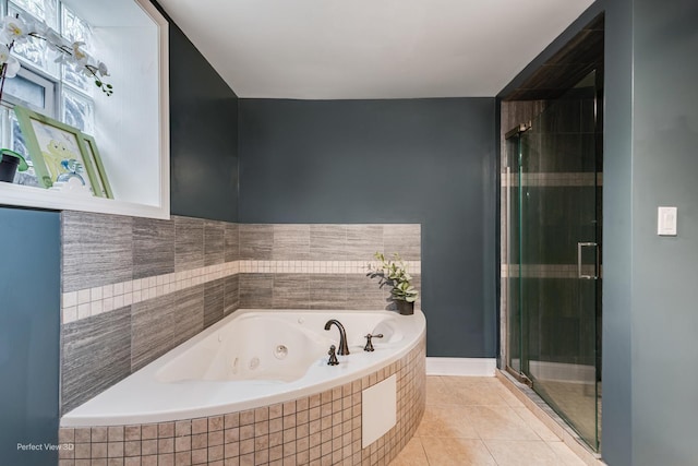 7612 N Rogers Ave Unit G, Chicago, IL 60626 - bathroom featuring a stall shower, a jetted tub, and tile patterned flooring