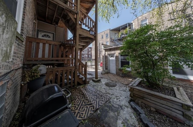 7612 N Rogers Ave Unit G, Chicago, IL 60626 - view of patio featuring stairs