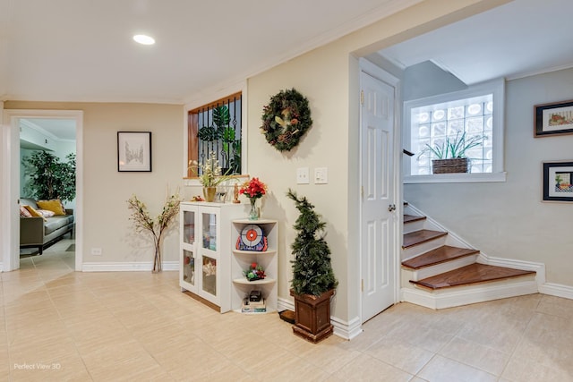 7612 N Rogers Ave Unit G, Chicago, IL 60626 - hall with stairway, tile patterned floors, crown molding, and recessed lighting