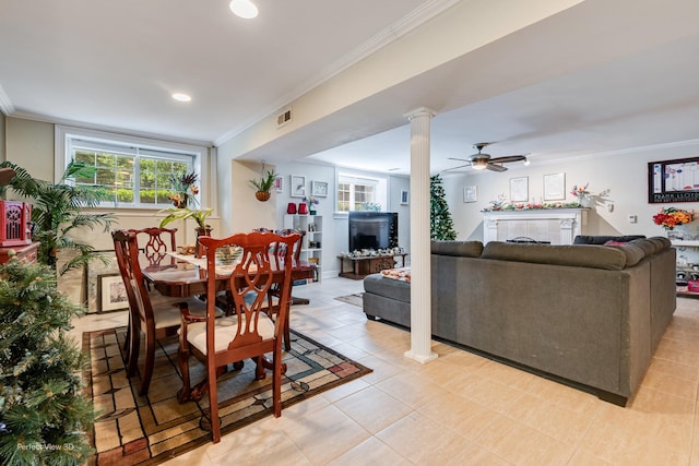 7612 N Rogers Ave Unit G, Chicago, IL 60626 - dining room with crown molding, a fireplace, recessed lighting, and decorative columns