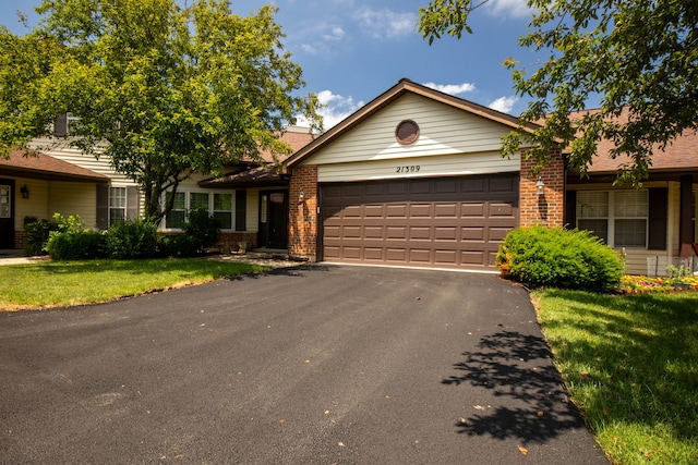 21309 Silktree Cir, Plainfield, IL 60544 - single story home featuring brick siding, a garage, driveway, and a front lawn