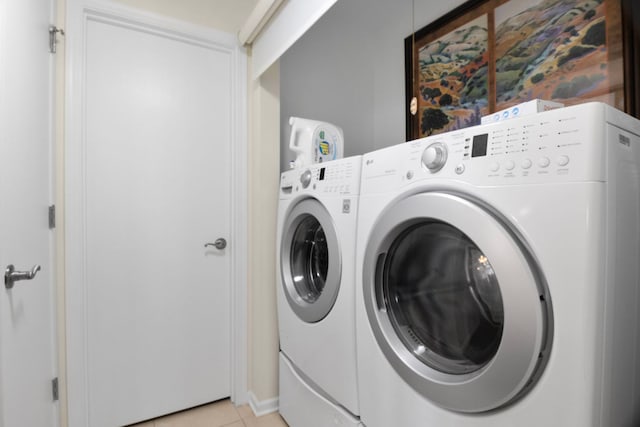 21309 Silktree Cir, Plainfield, IL 60544 - laundry room featuring washing machine and clothes dryer and light tile patterned flooring