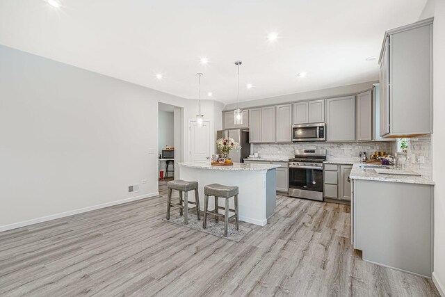 531 Alpine Dr, Algonquin, IL 60102 - kitchen featuring stainless steel appliances, gray cabinetry, light wood-style flooring, and recessed lighting