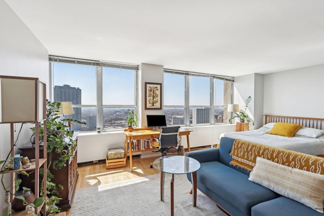 655 W Irving Park Rd Unit 2805, Chicago, IL 60613 - bedroom featuring wood finished floors and an office area