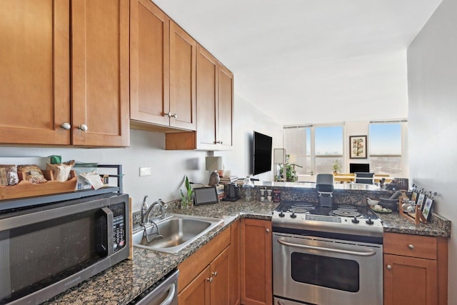 655 W Irving Park Rd Unit 2805, Chicago, IL 60613 - kitchen with stainless steel appliances, a peninsula, brown cabinetry, and dark stone counters
