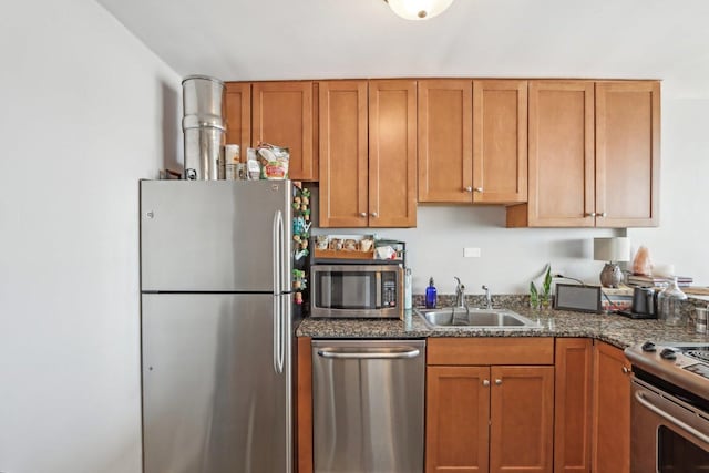 655 W Irving Park Rd Unit 2805, Chicago, IL 60613 - kitchen featuring stainless steel appliances, dark stone counters, and brown cabinetry