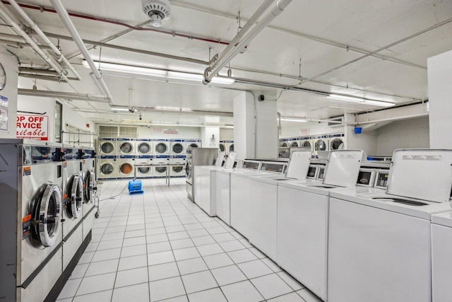 655 W Irving Park Rd Unit 2805, Chicago, IL 60613 - communal laundry room featuring estacked washer and dryer, washing machine and dryer, and light tile patterned floors