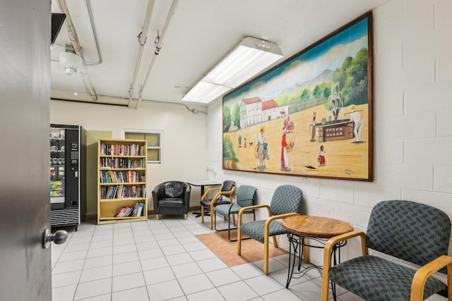 655 W Irving Park Rd Unit 2805, Chicago, IL 60613 - living area featuring tile patterned floors and concrete block wall