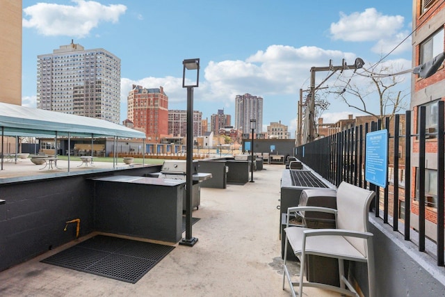 655 W Irving Park Rd Unit 2805, Chicago, IL 60613 - view of patio / terrace with a view of skyline