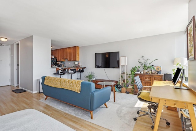 655 W Irving Park Rd Unit 2805, Chicago, IL 60613 - living room featuring light wood-style flooring and a desk