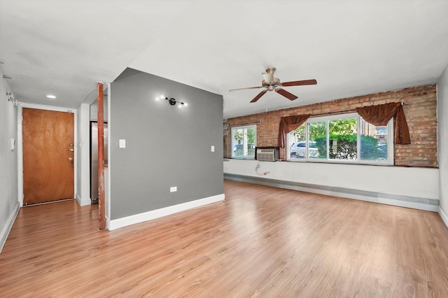 4113 W Cullom Ave Unit 1C, Chicago, IL 60641 - unfurnished living room featuring ceiling fan, light wood-style flooring, and cooling unit