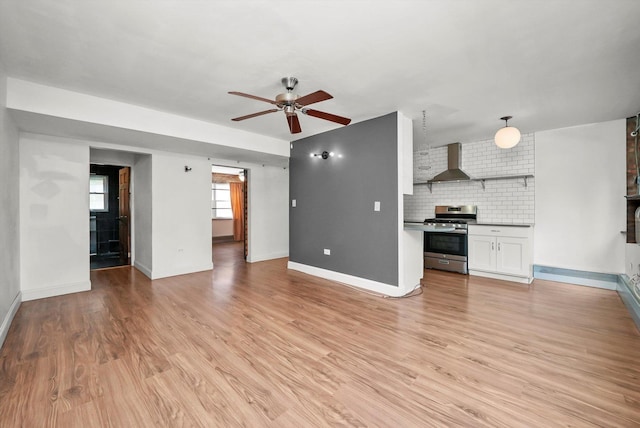4113 W Cullom Ave Unit 1C, Chicago, IL 60641 - unfurnished living room with a ceiling fan and light wood-type flooring