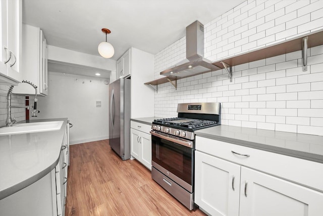 4113 W Cullom Ave Unit 1C, Chicago, IL 60641 - kitchen featuring appliances with stainless steel finishes, wall chimney range hood, tasteful backsplash, and white cabinetry