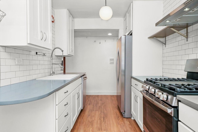 4113 W Cullom Ave Unit 1C, Chicago, IL 60641 - kitchen with stainless steel appliances, exhaust hood, decorative backsplash, white cabinets, and light wood-type flooring