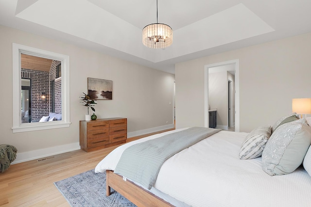 11155 Lizmore Ln Unit 35B, Orland Park, IL 60467 - bedroom with light wood-type flooring and a chandelier
