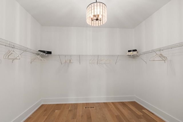 11155 Lizmore Ln Unit 35B, Orland Park, IL 60467 - spacious closet featuring light wood-style floors and a chandelier