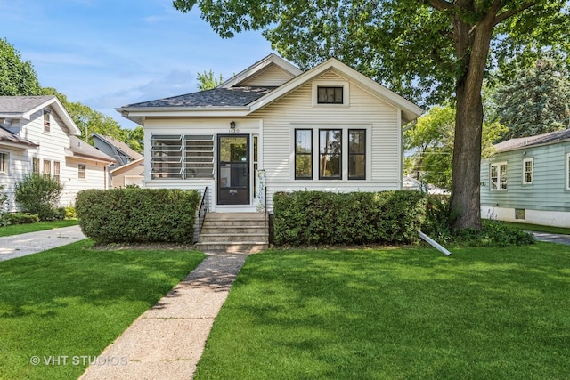 1620 Hyde Park Ave, Waukegan, IL 60085 - bungalow-style house featuring a front lawn and entry steps