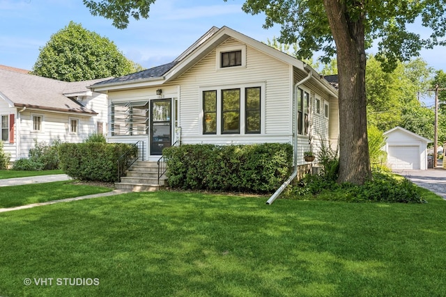 1620 Hyde Park Ave, Waukegan, IL 60085 - view of front facade featuring an outdoor structure, a front lawn, and a garage